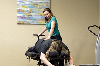Dr. Wallace stretching a Chandler chiropractic patient