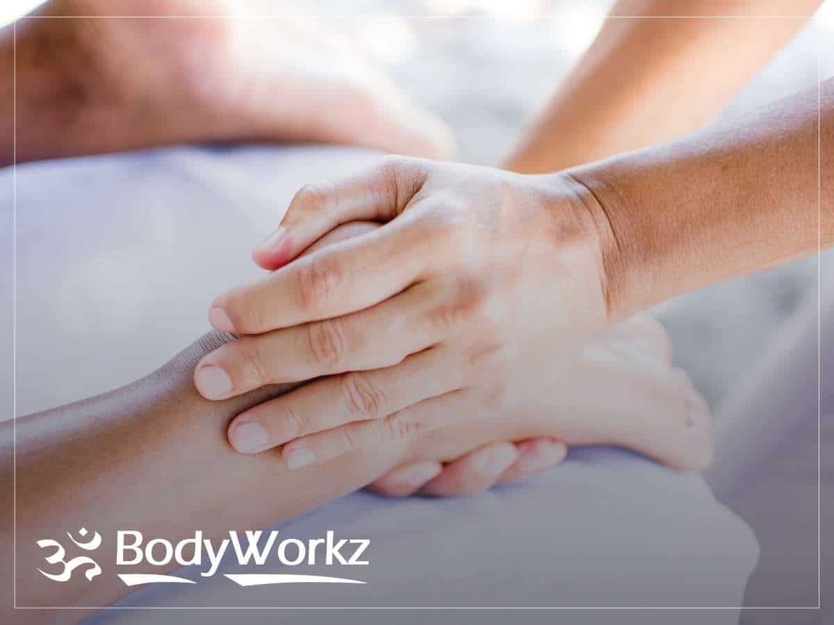 Scottsdale Chiropractor providing a therapeutic hand massage at BodyWorkz.